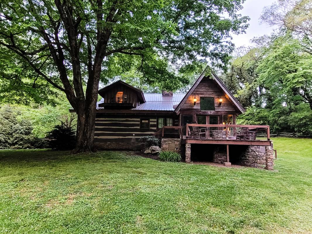 A 240-year-old log cabin onsite at The Stables atStrawberry Creek, a wedding venue in Knoxville